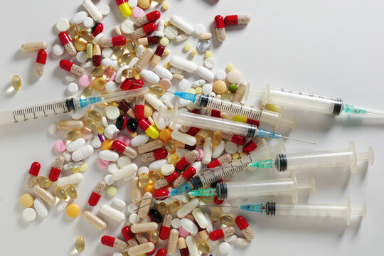 Assorted Pills and Syringes Background