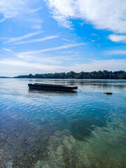 Wooden boat on calm river © Peter Mahr