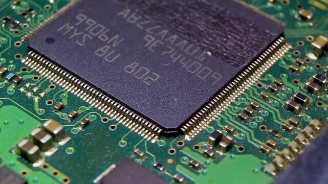 Electronic board with SMD components and a large microcircuit, video macro shooting