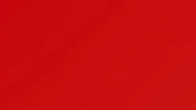 Animated social media like icon reveal with dynamic circular loading line on vibrant red background.