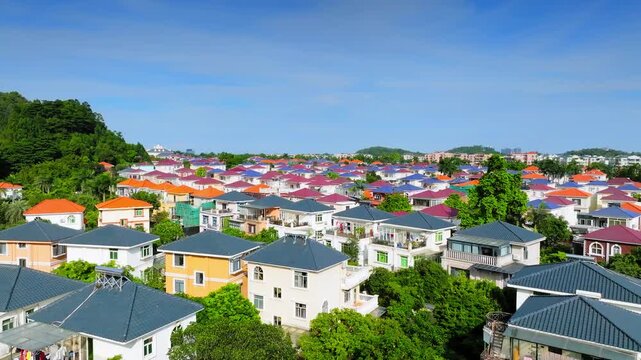 Colorful villa roofs among trees in Guangzhou