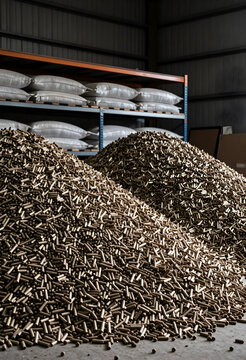 Biomass energy and renewable fuel production, large piles of wood pellets in industrial warehouse for sustainable heating and carbon neutral power supply