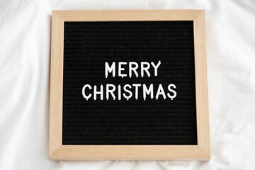 Merry Christmas on a wooden frame © Rawpixel.com