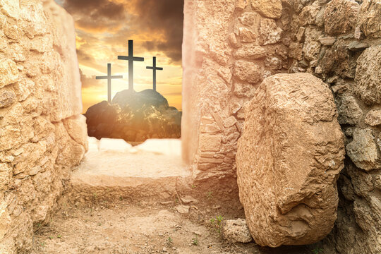 Empty Tomb of Jesus with Rolled Stone and Three Crosses at Sunrise