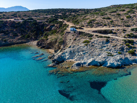 Agathia Beach in Milos, Greece offers mesmerizing blue waters and rugged cliffs. This tranquil spot is perfect for relaxation and enjoying nature's beauty under the warm sun.
