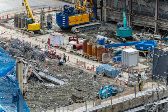 Urban construction site. Demolition, foundations, heavy machinery, machinery, redevelopment, general contractors, workers, infrastructure, construction, underground, safety