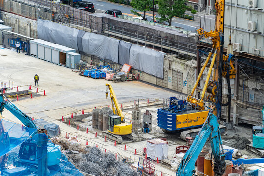 Urban construction site. Demolition, foundations, heavy machinery, machinery, redevelopment, general contractors, workers, infrastructure, construction, underground, safety