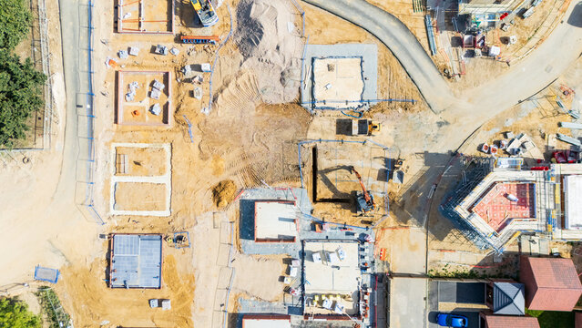 A top down drone view of a new housing site with plots and roads laid out