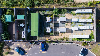Aerial view of a Battery Energy Storage System (BESS) at a renewable energy EV charging station storing excess energy generated © Richard O'Donoghue
