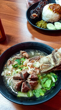 Indonesian Bakso Iga rib Meatball Soup with Grilled Ribs and Rice
