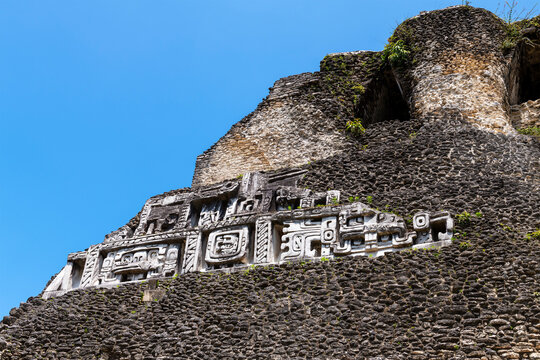 Mayan carvings on El Castillo pyramid, Xunantunich, Belize.