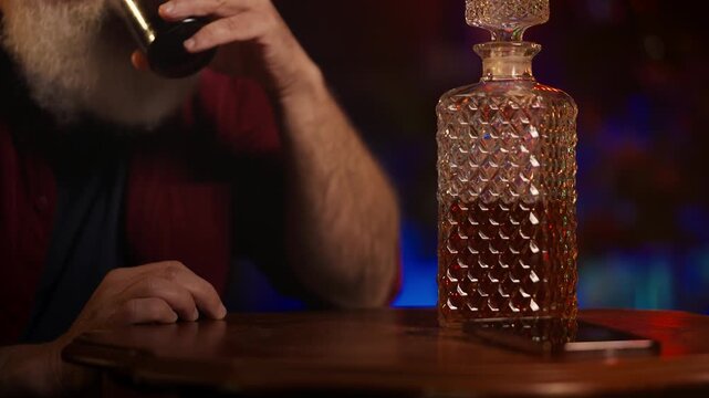 Depressed middle-aged man copes with holiday stress by drinking at home