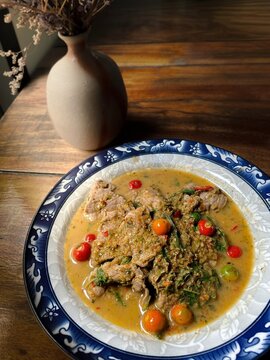 Stir-fried sliced beef with cherry pepper, served with vibrant cherry peppers. A savory, aromatic, and spicy Asian dish perfect for professional food photography	