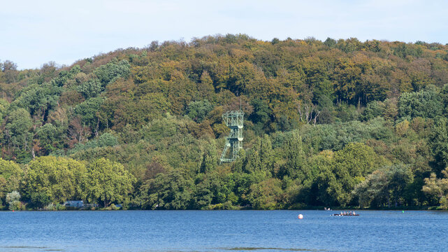 Historic mining headframe rising above woodland near Baldeneysee, reflecting the industrial heritage of the Ruhr region.