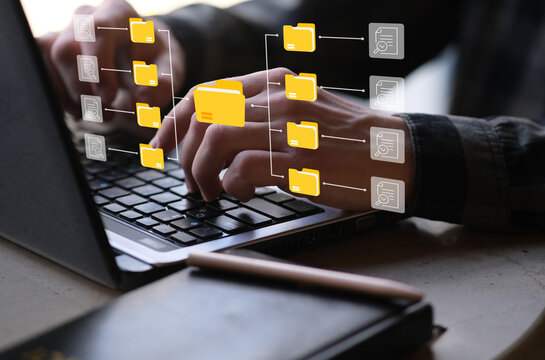 businessman with laptop manage data with folders concept a screen technology document management system data digital efficient business organization