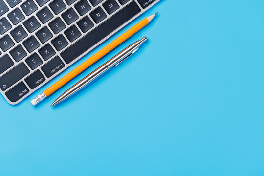 Office supplies on blue desk