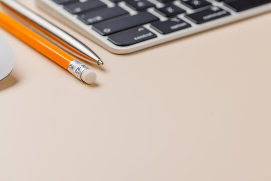 Office supplies on beige desk
