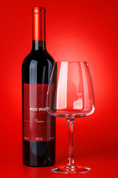 Red wine bottle mockup on red background