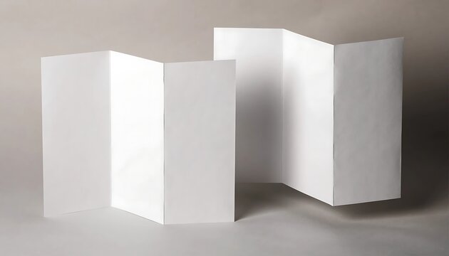 Two empty white paper brochures folded in a zigzag accordion style