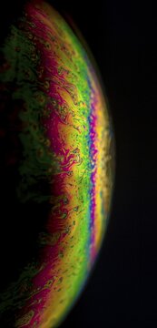 Interference of equal thickness, soap bubble, light reflected in all colours