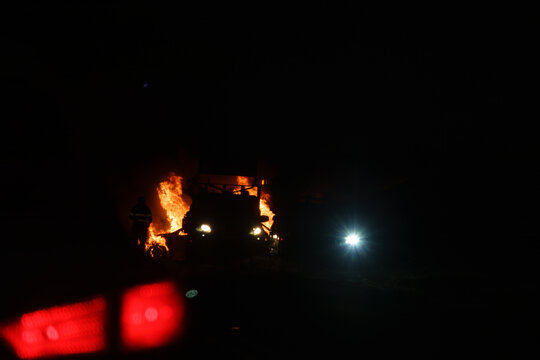 Berridale, New South Wales, Australia - September 29, 2026: Car on fire burning on side of Kosciuszko Road just north of Berridale with emergency crews attending
