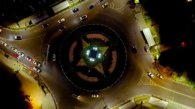 Simferopol, Crimea. Car traffic on Sovetskaya Square. Night time. Drone footage, HEAD OVER SHOT with rotation