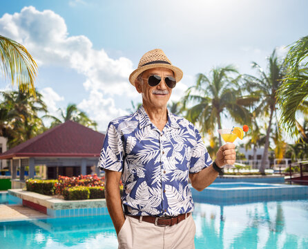 Smiling male toursit with a cocktail