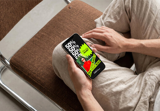 Hands Holding Smartphone While Seated Mockup