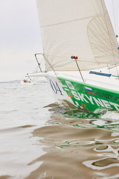 Russia, St.Petersburg, 22 August 2026: bow of sailing boat is in sailing regatta in the Gulf of Finland, board the boat, magic reflection