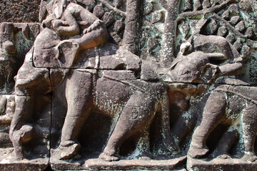 Fototapeta premium sculpted terrace in a ruined khmer hindu and buddhist complex (angkor thom) in angkor in siem reap in cambodia 