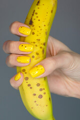 hand holding a yellow banana © Екатерина Третьякова