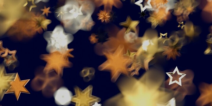 Abstract background with shimmering golden and white star-shaped bokeh lights.