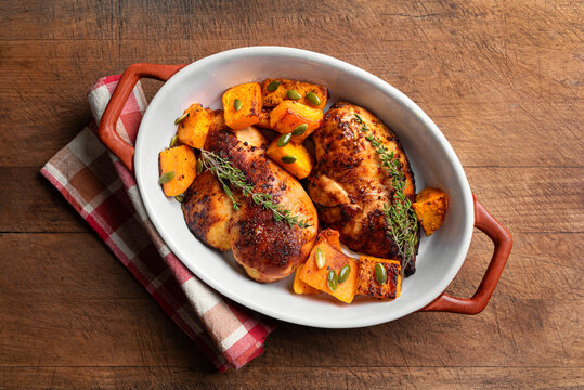 Autumn meal: roasted chicken breast and pumpkin with herbs