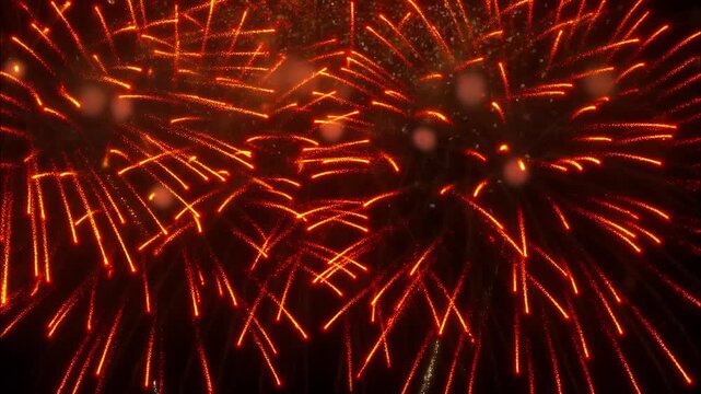 Golden fireworks exploding in the night sky during a celebratory event for a holiday like new year's eve or the 4th of july