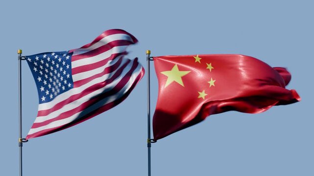 Flags of The United States and China Waving Against Blue Sky