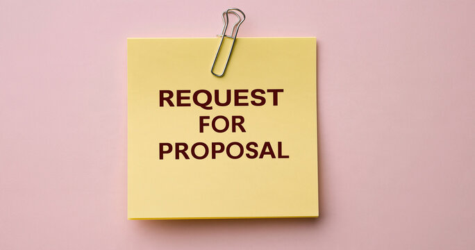 Request for proposal written on a yellow sticky note against a pink background. Business strategy concept for corporate presentations.