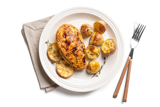 Oven roasted lemon garlic chicken and potatoes on plate