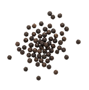 Top view of a scattered pile of dried black peppercorns isolated on a clean white background