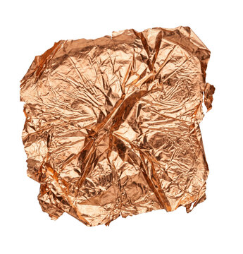 Crumpled sheet of metallic copper foil with a reflective texture isolated on white background