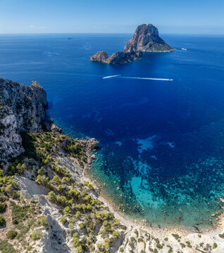 Aerial view from the cliffs of Torre des Savinar, Ibiza, Balearic Islands, Spain. The Es Vedr&agrave; islet lies approximately 2.5 kilometers off the coast, near Cala d'Hort
