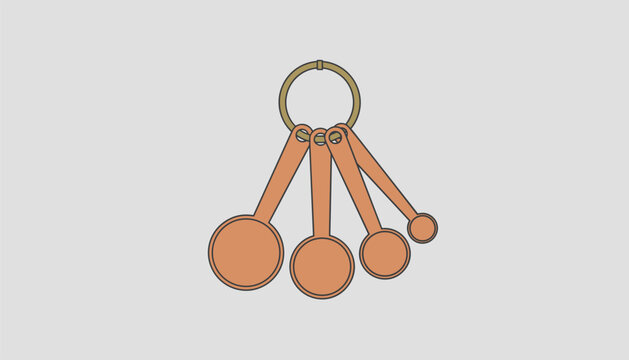 Set of four copper measuring spoons linked together on a metal ring are displayed on a light surface.