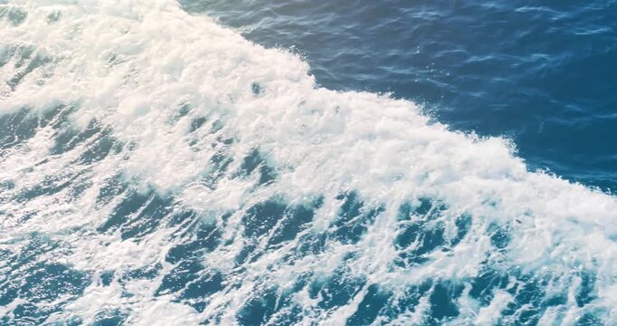 Ocean sea blue wave background. Surface of tropical empty wake of moving water in motion on sunny summer day.