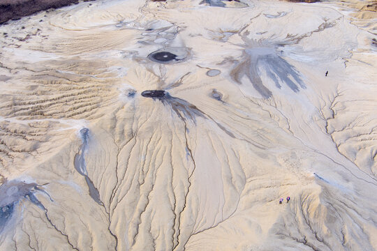 Aerial view of the Mud Volcanoes of Paclele Mari featuring unique mud craters and dry channels in the arid landscape of Paclele, Buzau County, Romania.