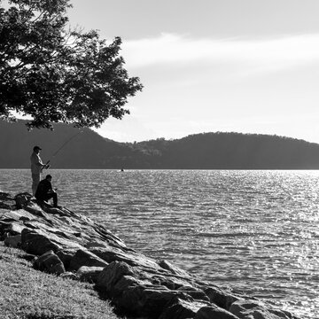 Black and White Landscape of two men fishing on the river 