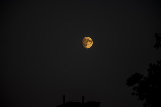 Crescent moon phase glowing in dark night sky