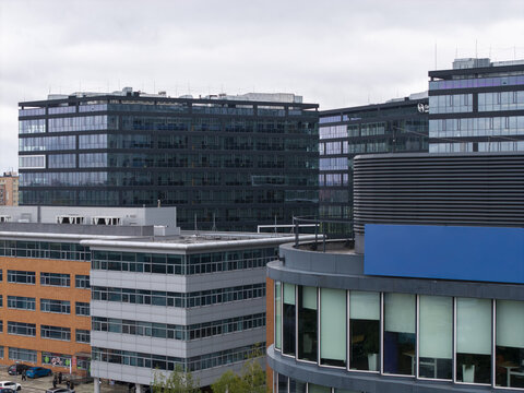 Aerial view of modern office buildings with glass facades and brick cladding in a business park in Krakow, Lesser Poland Voivode, Poland.