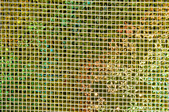 Reflective metallic square mosaic with iridescent light diffraction pattern