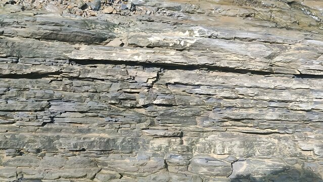 Natural Sedimentary Rock Layers Displaying Geological Stratification Outdoors