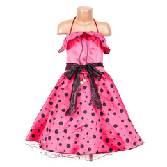 Bright pink girls party dress with black polka dots, ruffled neckline and sheer black waist sash displayed on a child mannequin against a clean white background. © Jan