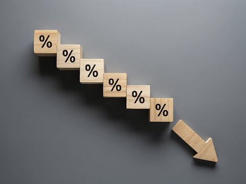 Wooden blocks with percentage signs arranged in a downward stair step trend